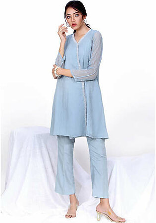 Ash blue v neckline Angrakha styled shirt with embellished patti on the front shirt, detailed with pintucks on front. Full sleeves comprising of pintucks an scattered sequin handwork paired with matching solid pants 2-Piece Color: Ash blue Fabric: Chiffon (Shirt) Front Length: 37"...