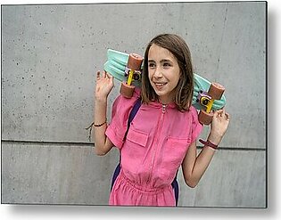 Smiling Teenage Girl Holding A Skateboard In Front Of Concret Wall Metal Print