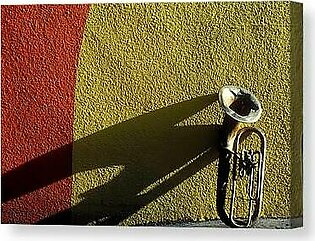 Old tuba with shadow Canvas Print