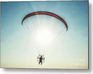 Paraglider in the air, beautiful blue sky in the background. Metal Print