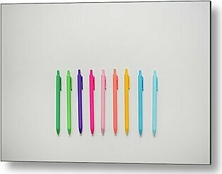 Colorful Pens Lined Up On Plain White Table Metal Print